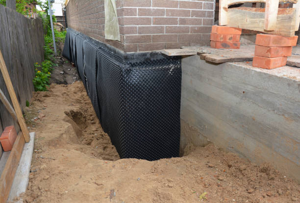 Happy homeowners after waterproofing job in Cloverdale